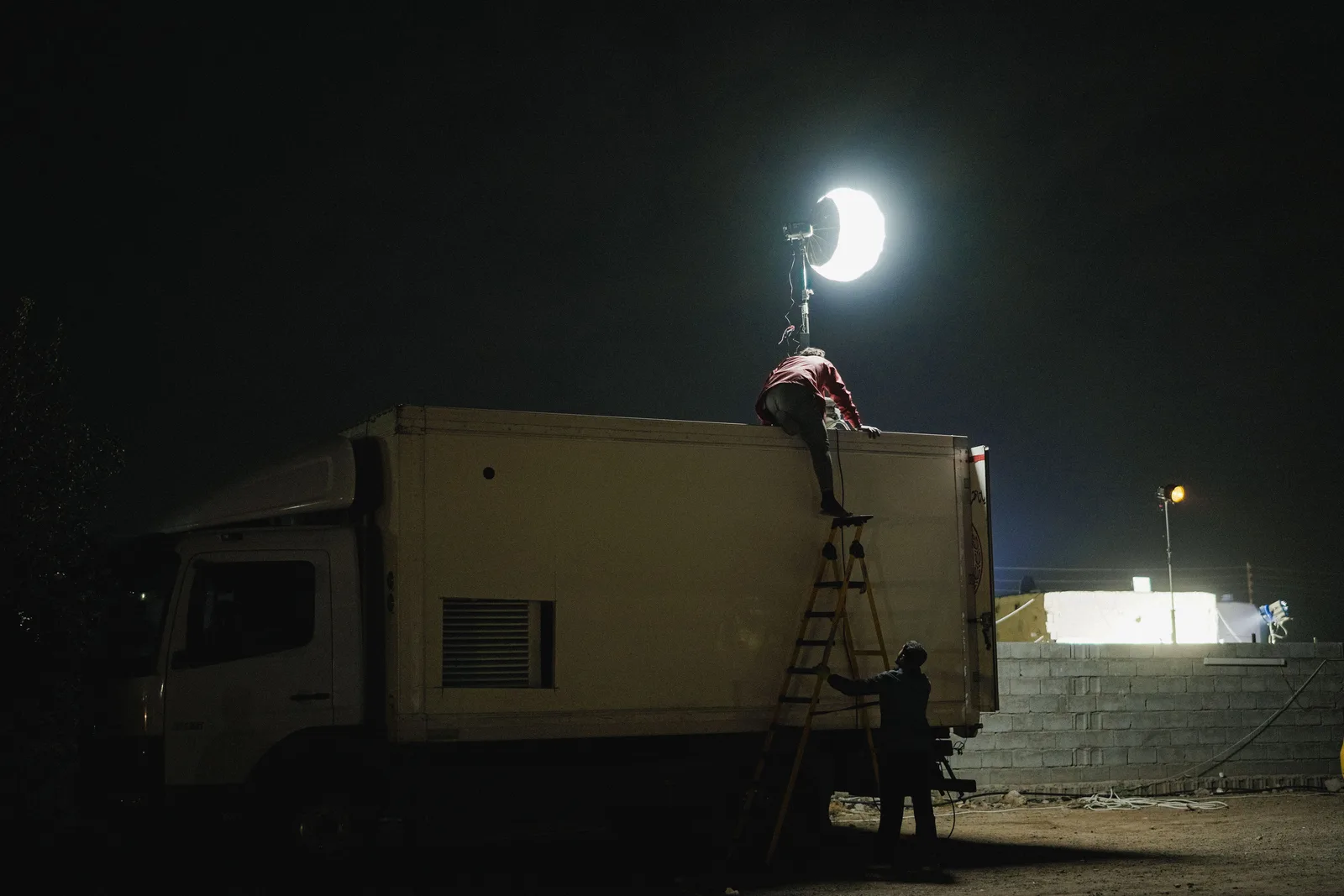 A film crew lighting truck on a night shoot in Los Angeles