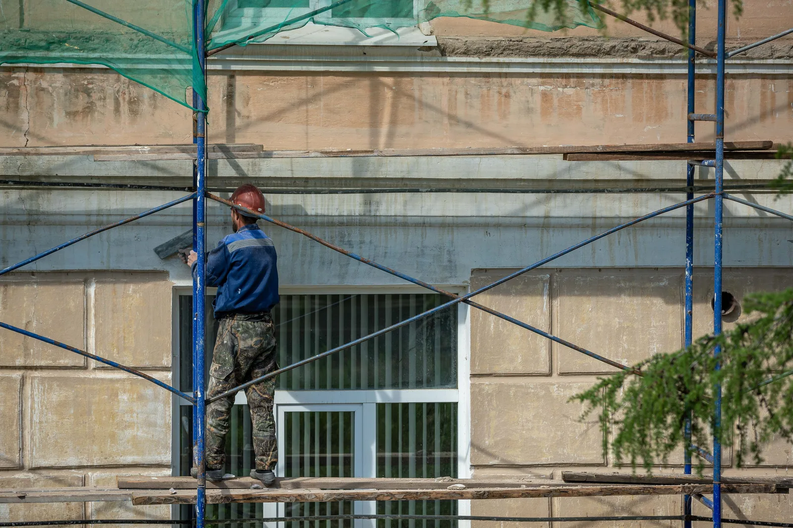 Facade repair crew on scaffolding in Philadelphia