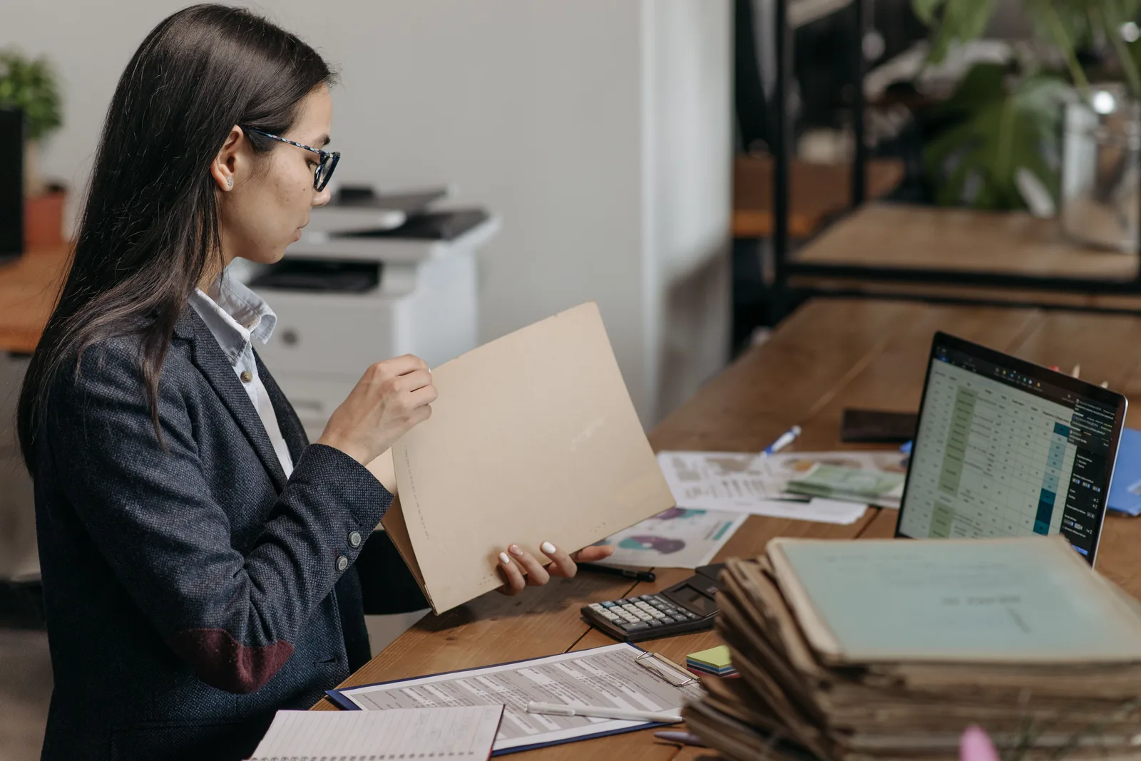 Professional services practitioner working at a desk between client appointments