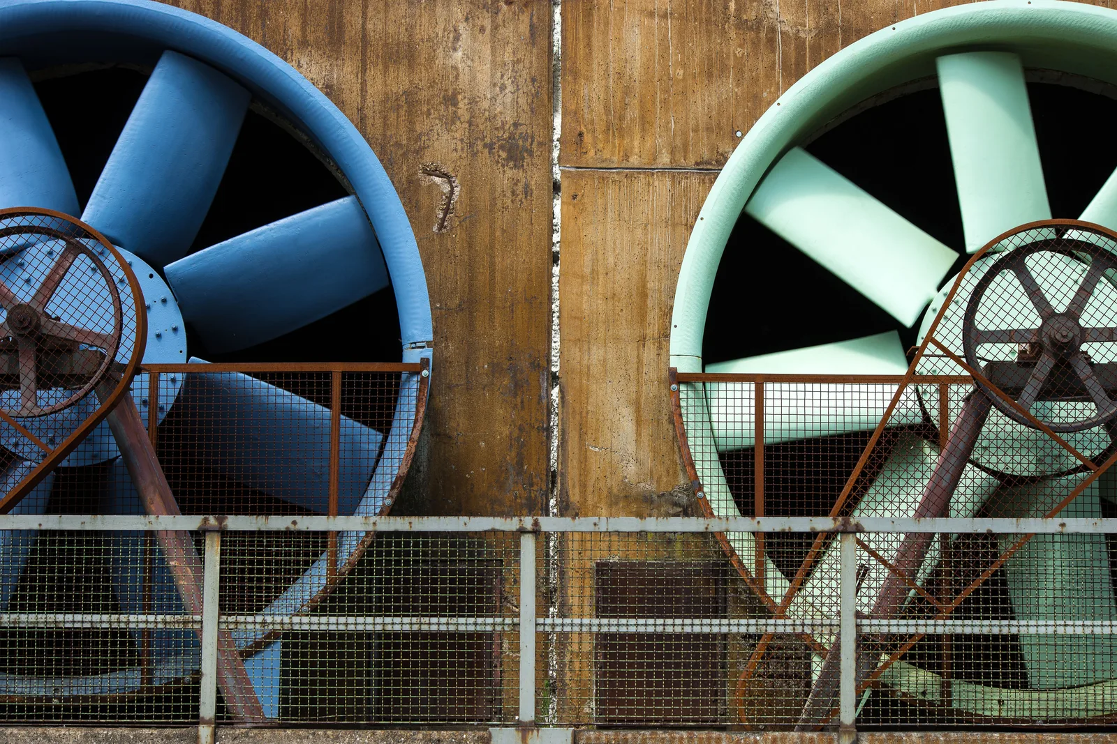 Large building ventilation fans in a mechanical room