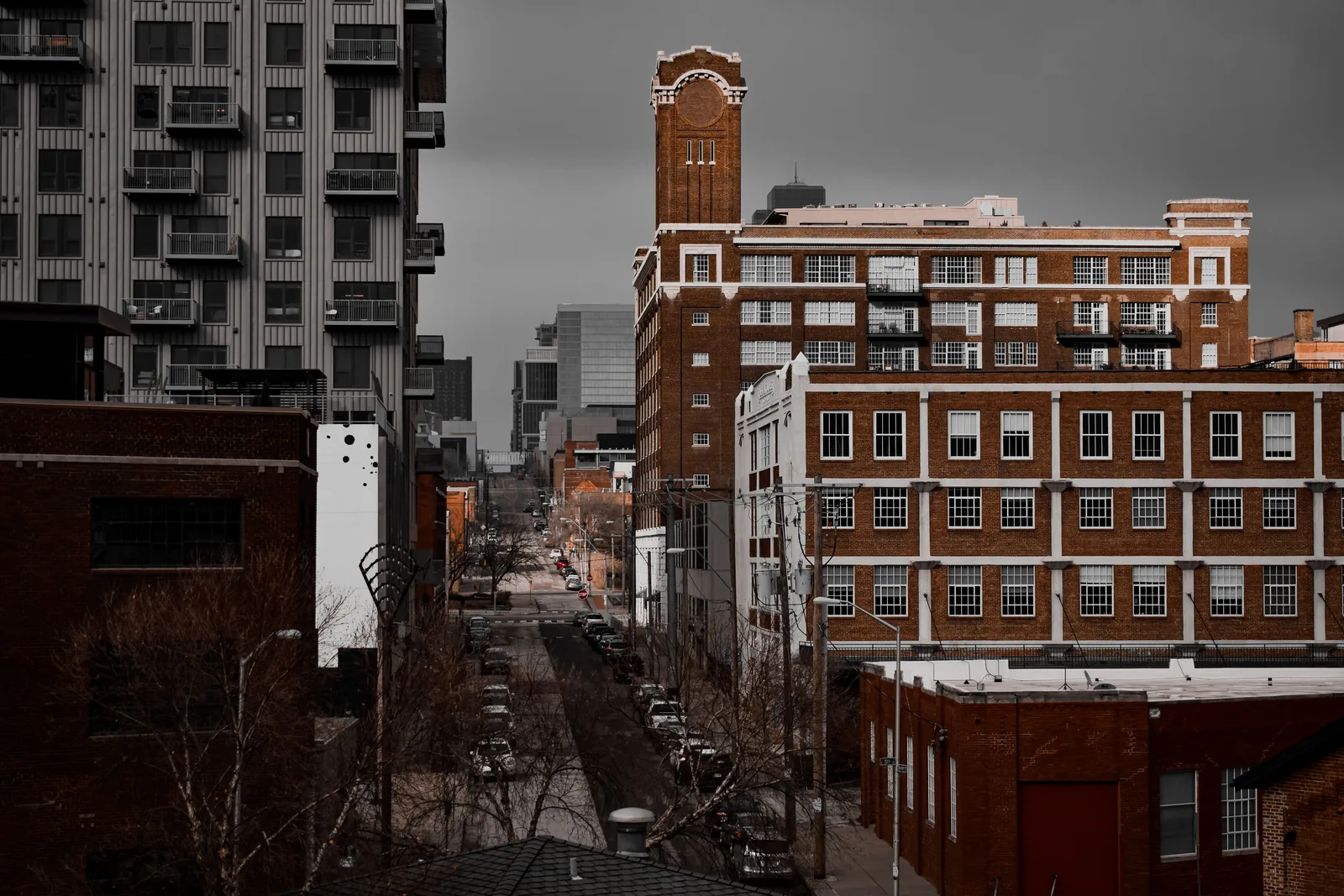 Street lined with brick and modern apartment buildings in Kansas City, Missouri