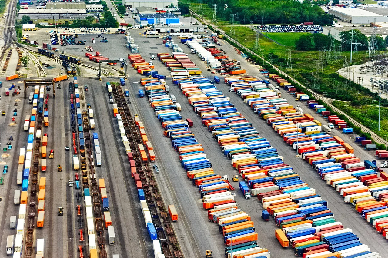 Shipping containers stacked at an intermodal freight yard