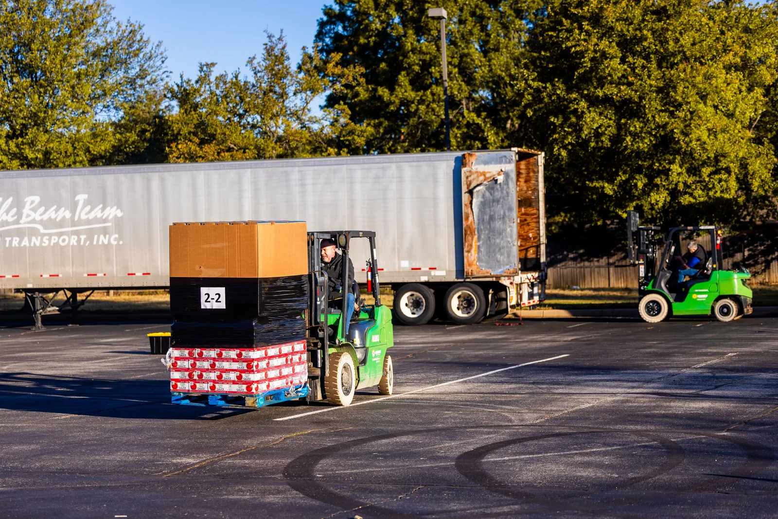 Workers loading a delivery trailer
